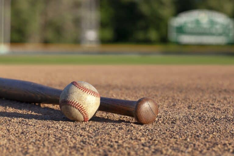 Baseball and bat low angle view on a baseball field