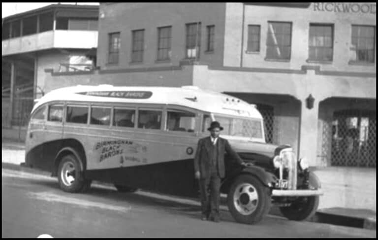 1940 circa Tom Hayes - Birmingham Black Barons owner with team bus at the entrance to Rickwood Field